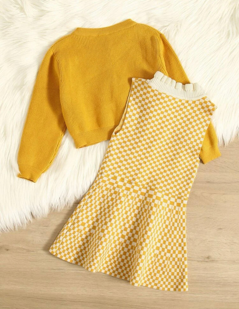 Back view of girls collared sleeveless yellow checkered dress with cardigan sweater